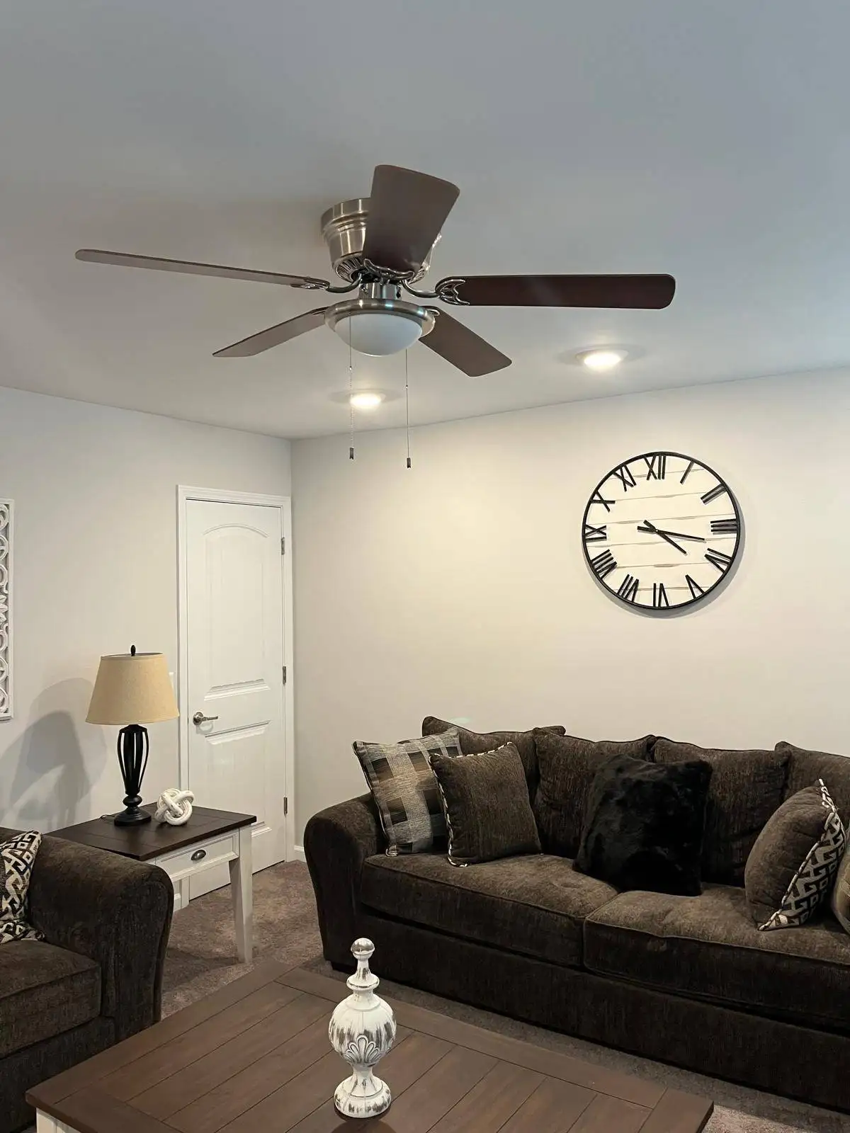 Installing a Ceiling fan in the living room.