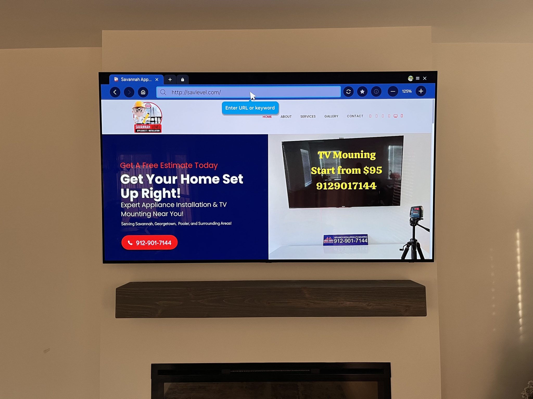 Wall-mounted TV displaying the Savannah Level home services website